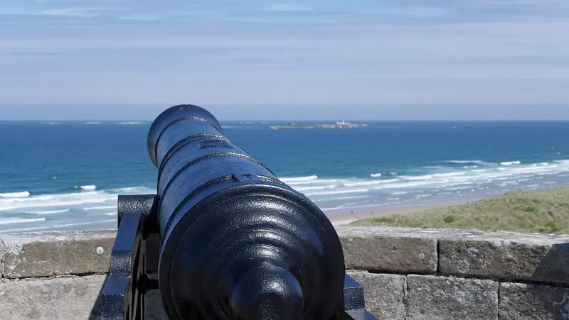 Bamburgh Castle: A cannon facing out to sea at Bamburgh Castle.