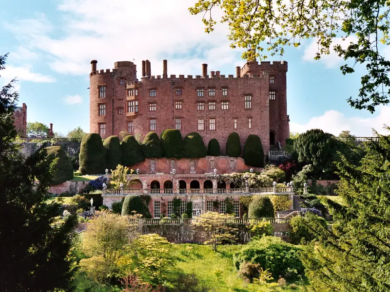 Powis Castle: Powis Castle, originally built c. 1200 as a fortress of the Welsh Princes of Powys. The castle sits on a rock above terraces with beautiful flowers and plants and ove