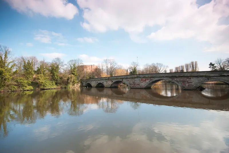 Tamworth Castle: The River Tame at Tamworth. Viewed from the west with Lady Bridge in the foreground and Tamworth Castle on the hill in the background.